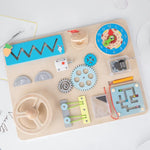 Busy Board tout en 1 labyrinthe magnétique boite à musique et volant - Vignette | Le Poussin Ludique
